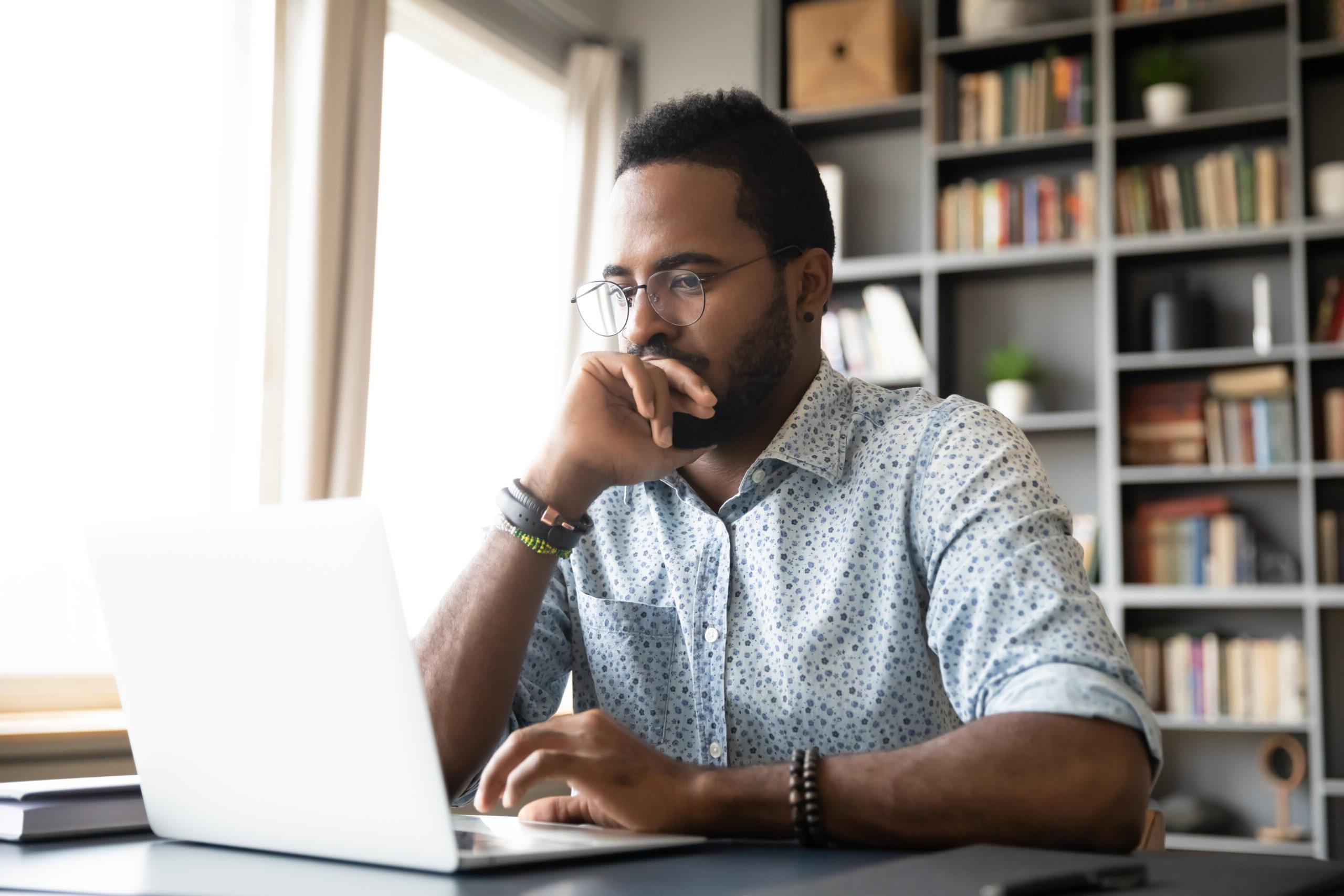 man searching computer for natural disaster resources